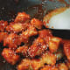 Add the toasted sesame seeds into the chicken mixture.
