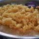 Add cooked pasta and mix well.