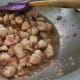Add salt, black pepper, and white pepper. Cook for about 3 minutes.