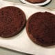 Level the top of the cakes by using a serrated knife.