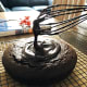 Spreading the chocolate glaze on the cake.