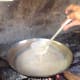 The oil starts to separate from the coconut milk.