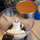 In your food processor, add your coconut oil and caramel sauce.