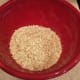 Start by pouring your oats into a large mixing bowl.