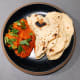 Chicken tikka masala with naan bread.