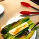 Unwrap the banana leaf before eating the pulut panggang.
