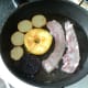 Bacon is added to frying pan