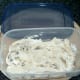 Cream is spooned in to freezing dish