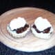 Whipped cream is spooned on to mincemeat