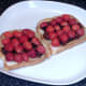 Halved strawberries are arranged on top of spread mincemeat