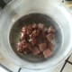 Chocolate and mincemeat are placed in a glass bowl over simmering water