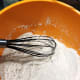 In a separate bowl, sieve the flour, sugar, salt, baking soda, and baking powder. Using a whisk, combine the ingredients.