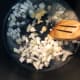 Once the butter is melted, add the chopped onion.