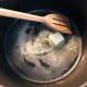 Heat cooking oil with butter.