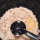 Add the wet ingredients—vinegar and cold water—to the mixture.