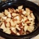 When you're finished, slide those straight into your crockpot as well. Add 4 cups of chicken broth straight over the top.