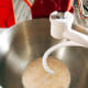 Combine the yeast, warm milk, and sugar in the mixing bowl. Let it sit for 5 minutes or until it forms a foamy mixture.