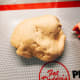 Transfer the dough onto a baking mat or floured surface.