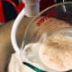 Add the yeast mixture into the mixing bowl.