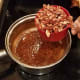Remove from heat and add your vanilla extract and pecans.