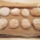 Roll each into a dome shape and place on your parchment paper.