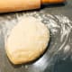 Divide the dough into 2 equal-size portions.