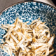 Clean the anchovies, rinse, and put them in a bowl.