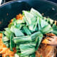 Add the mustard greens.