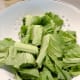 Rinse and chop the mustard greens.