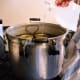 Add a splash of vinegar, to avoid hard water stains on your canner and jars.
