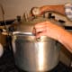 ...and tighten screws in pairs...or fasten according to the style of your canner.