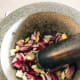 Combine the chopped ingredients in the mortar. Pound it until it forms a paste.