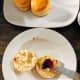 Slice a scone and spread with butter or jam.