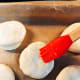 Brush the tops with egg wash.