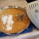 Next mash and then add in your sweet potatoes and butter and blend. Finally add your baking powder.
