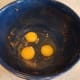 Crack your eggs into a large mixing bowl. (My bowl was just used for making pumpkin spice banana bread. The ingredients were so alike I didn't think it was necessary to wash the bowl out.)