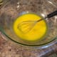 The yolks become bright yellow after you whisk them together. Make sure you don't whisk with too much enthusiasm, as the yolks will start to foam.