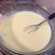 The liquid becomes a pale yellow after the key lime juice is added.