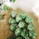 Roll ondeh-ondeh around the grated coconut.