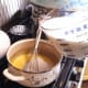 Add milk slowly, whisking at intervals. . .