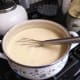 Milk may become frothy as you whisk. Heat gently until it bubbles, stirring often all over the bottom of the saucepan. Boil 1 minute.