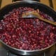 Reduce the flame. Add two cups of water. Mix well. Cover the pan and cook for about 10 minutes or until both beetroot and mung beans cook properly.