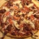 In the Florida Everglades, a restaurant called Evan's Neighborhood Pizza sells a pizza made with python, frog's legs and alligator sausage.
