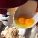 Add butter and eggs into the mixture.