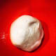 Transfer the dough into a greased bowl. Let it stand in a warm place for 2 hours.