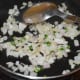 Step one: Saute green chilies, spring onion greens, and chopped onions until onions become pinkish.