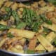 Pour the seasoning on the baby corn capsicum fry mixture.