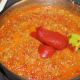 Adding tomato paste,