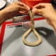 Shape the rope into a pretzel shape.