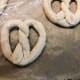 Transfer the pretzels on the prepared baking pan.